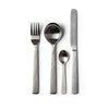This image depicts Acme's brushed fork, spoon, teaspoon and knife flat-lay on a plain white background